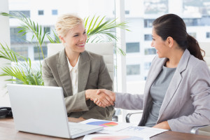 Businesswomen shaking hands